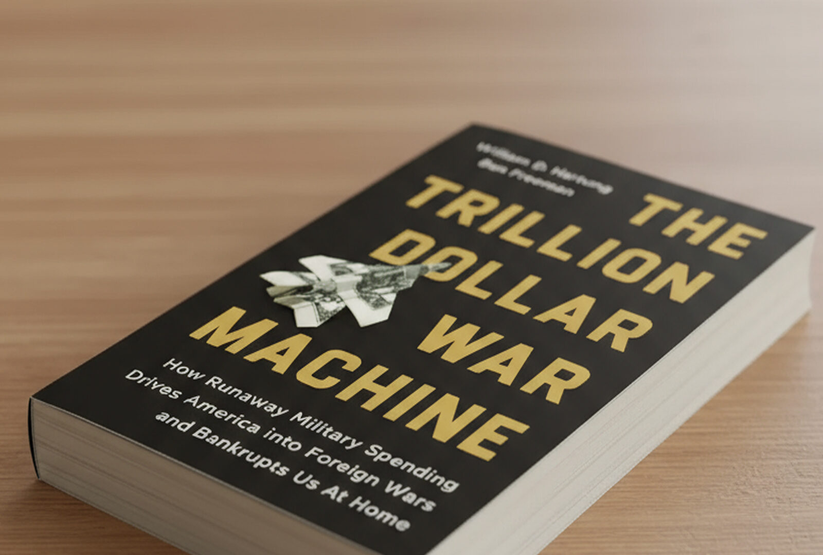 A photo of a the book Trillion Dollar War Machine sitting on a desk.